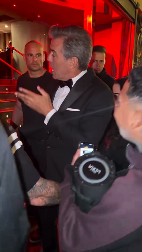 Opening of a Bulin 47 AI video: the crowd pushes in at a red-lit door